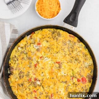 Sausage & Red Pepper Frittata - Sweet red peppers and savoury sausage are a delight together in this easy and delicious recipe. Served with a salad and fresh bread, it's the perfect quick weeknight meal!