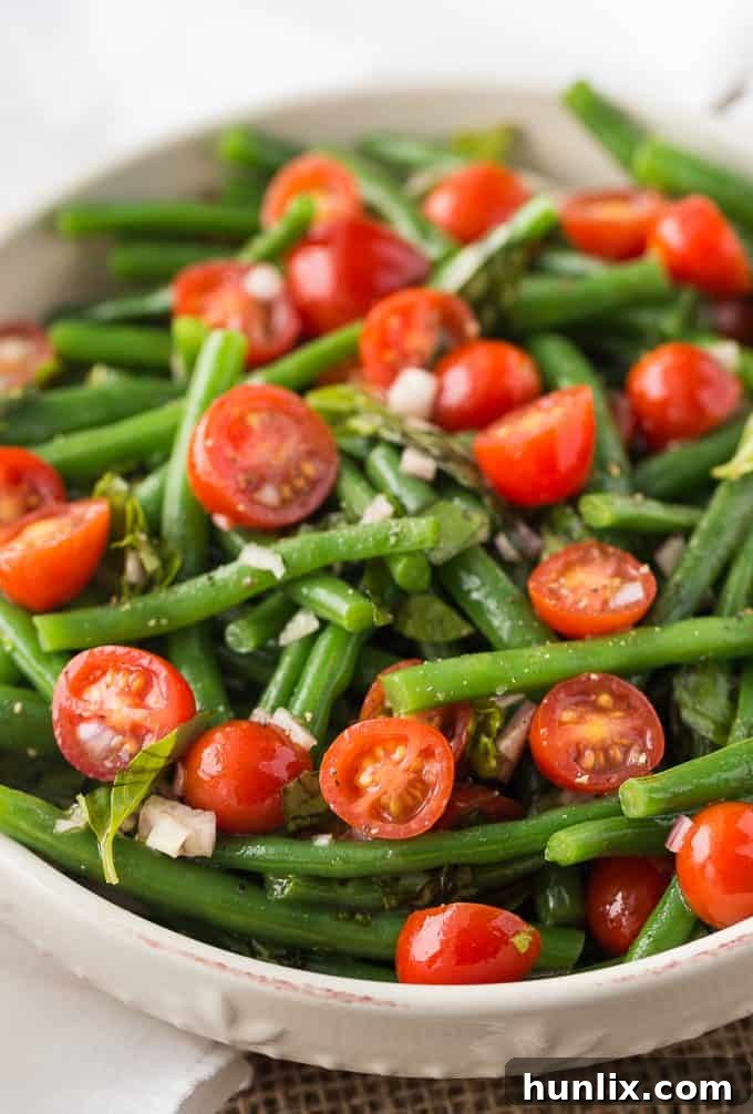 Freshly washed and trimmed green beans ready for blanching, a key step in making the Green Bean and Tomato Salad.