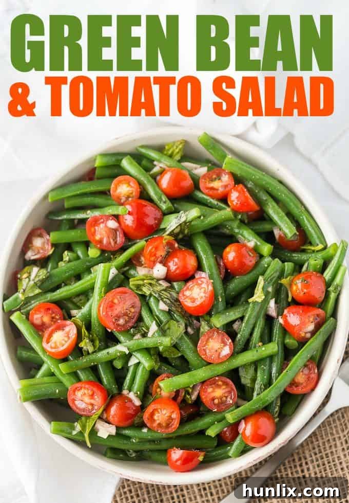 Close-up of vibrant green beans and ripe cherry tomatoes, highlighting the freshness essential for a delicious Green Bean and Tomato Salad.