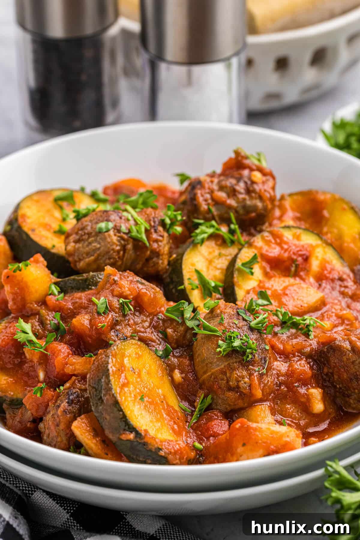 Italian sausage and vegetable stew in a bowl.