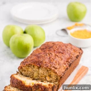 Tangy Cheddar and Sweet Apple Quick Bread 7 A loaf of Apple Cheddar Quick Bread with slices cut on the end