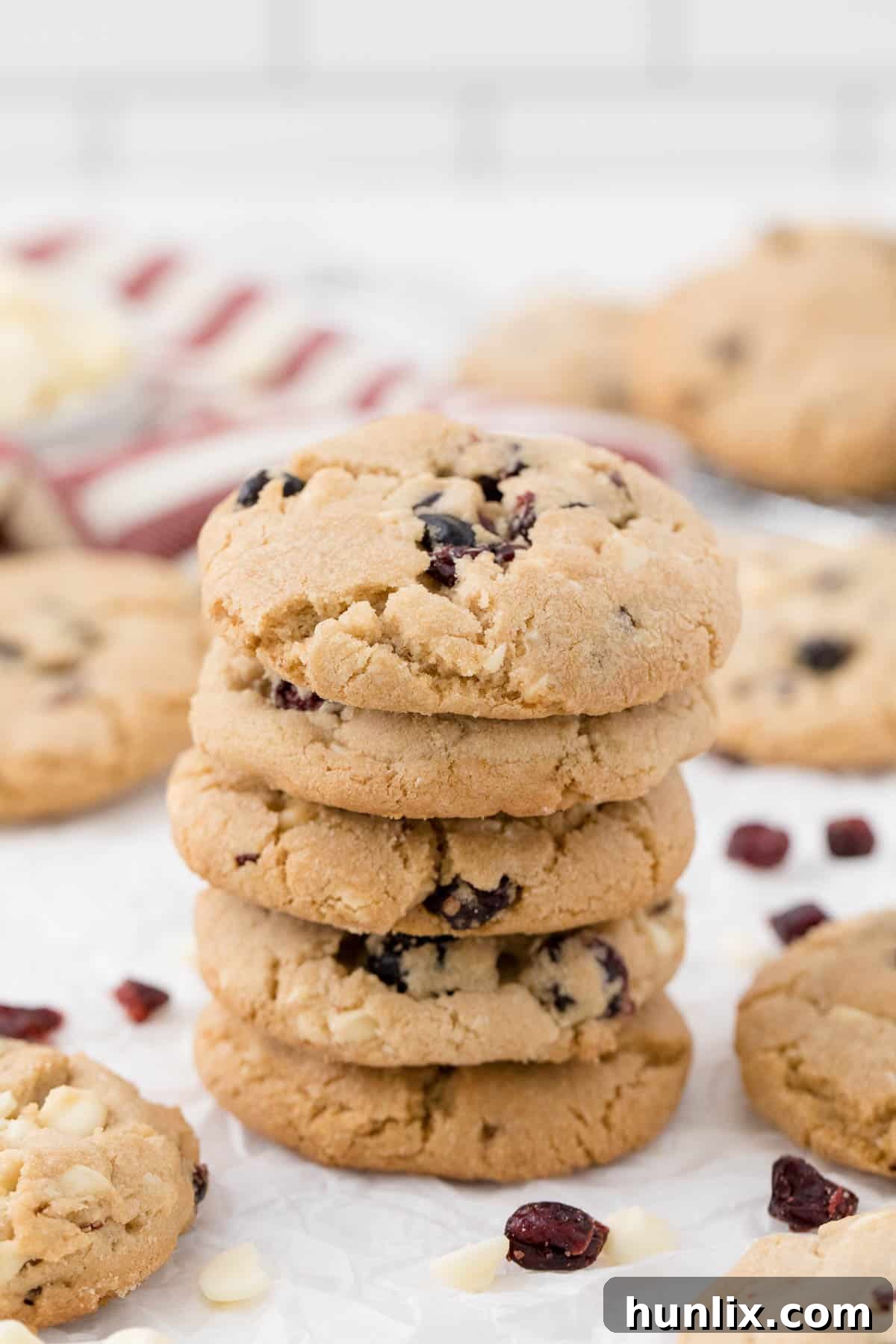 a stack of white chocolate chunk cranberry cookies