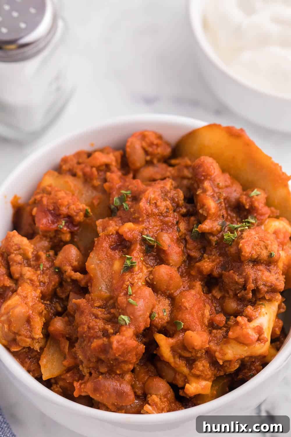 Rustic Ranch Chicken Chili Casserole 5 Finished Slow Cooker Cowboy Chicken Chili Casserole, browned and bubbly, ready to serve