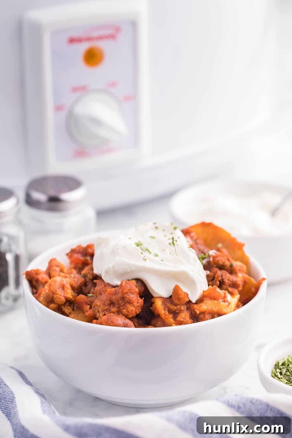 Rustic Ranch Chicken Chili Casserole 6 A serving of Cowboy Chicken Chili Casserole with melted cheese on top