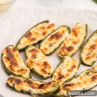 Cheese Stuffed Jalapenos - The best vegetarian appetizer to feed a crowd! Just 5 ingredients for this perfect party recipe.