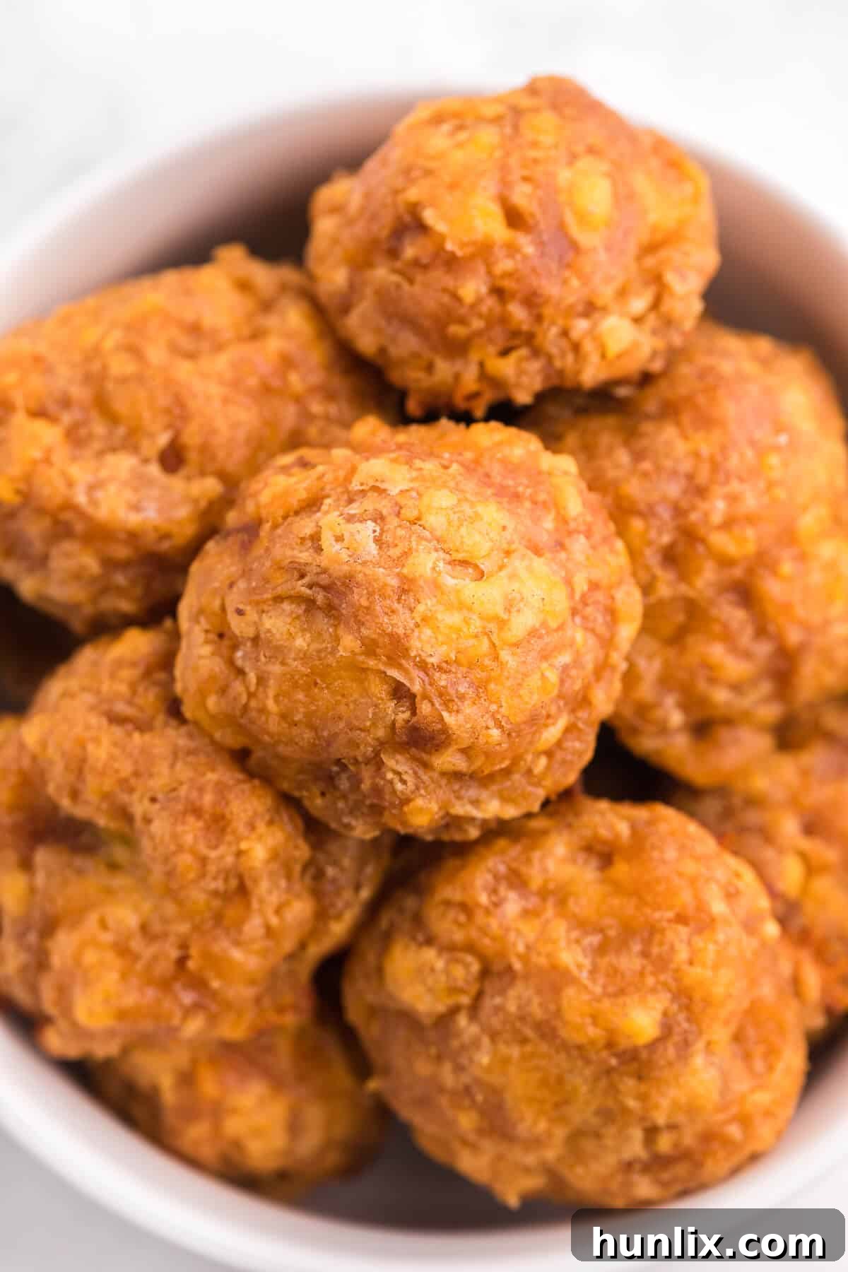 Olive Cheese Balls - A holiday favorite with a vegetarian twist! These perfect hors d'oeuvres are packed with olives, cheese, paprika, Worcestershire sauce, and a pinch of cayenne pepper.