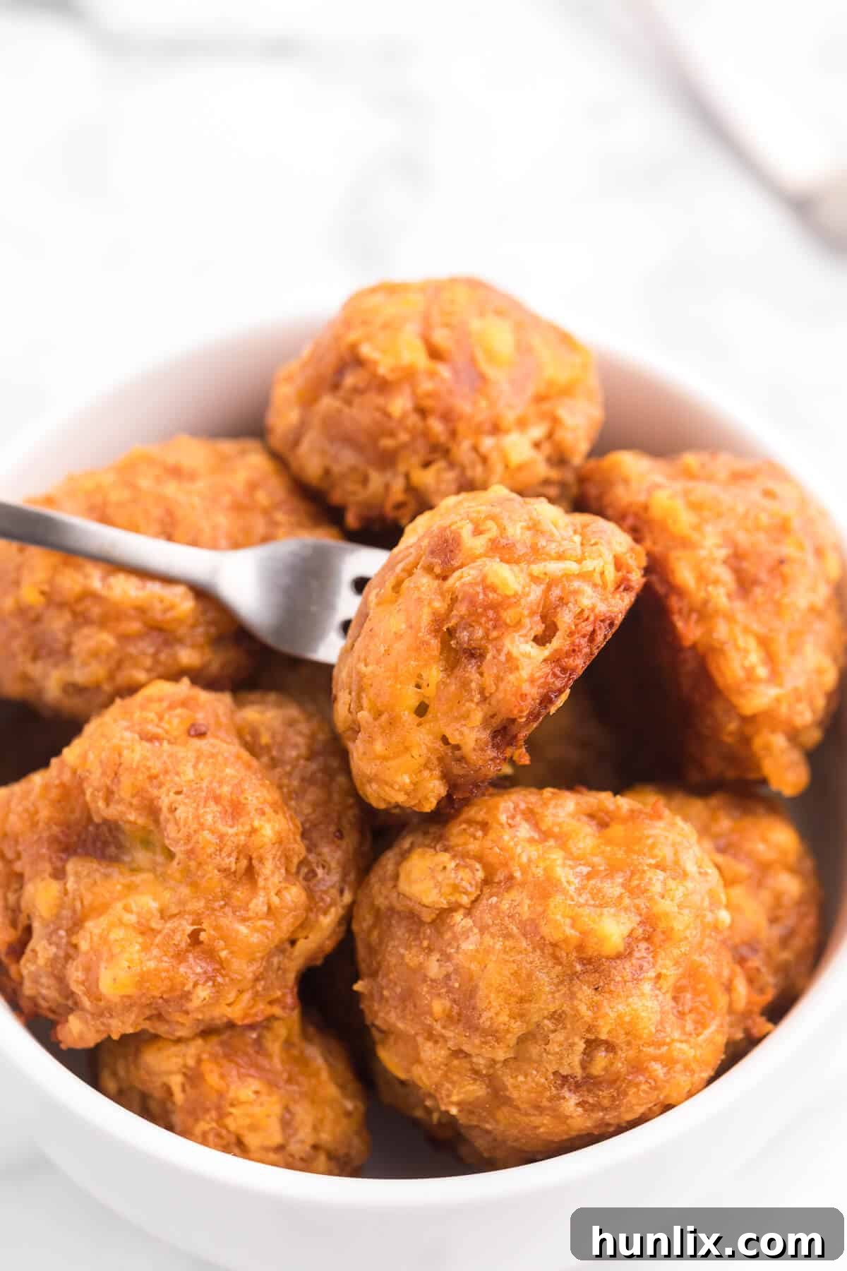 Olive Cheese Balls - A holiday favorite with a vegetarian twist! These perfect hors d'oeuvres are packed with olives, cheese, paprika, Worcestershire sauce, and a pinch of cayenne pepper.