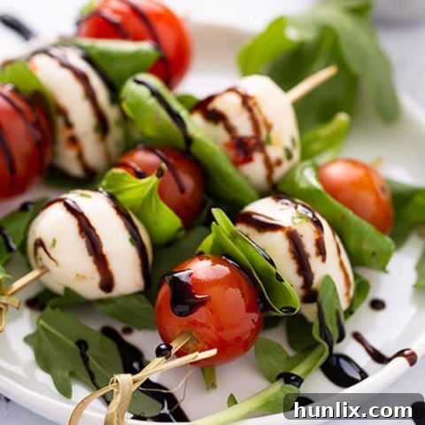 Caprese Skewers - A flavorful and pretty appetizer or snack, transforming classic Caprese salad ingredients into easy skewers. Perfect for brunch, holidays, or summer gatherings.