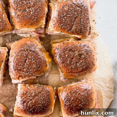 Baked Mini Party Sandwiches with Brown Sugar Glaze - Addictive mini party sandwiches with a brown sugar glaze, easy to make ahead for any crowd.