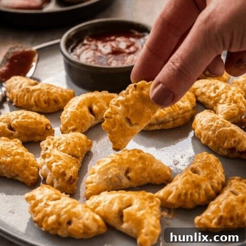 Mini Bacon and Onion Pasties - Truly delicious and simple appetizers with caramelized bacon and onion baked in golden, flaky pastry.