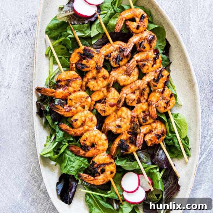 Korean Grilled Shrimp Skewers - Easy, ready in under 15 minutes, and packed with tangy, savory, sweet, and spicy flavor from a unique gochujang marinade.