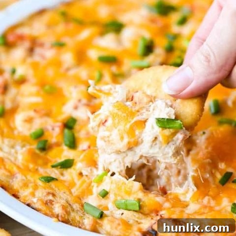 Hot Crab Dip with Peppadew Peppers - The perfect creamy, cheesy party food with a little heat and lots of cheese. A guaranteed crowd pleaser!