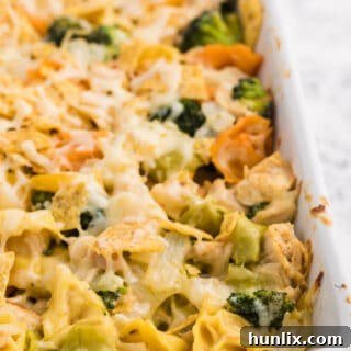 Santa Fe Chicken Tortellini Casserole - Creamy tortellini pasta with veggies and chicken, topped with crunchy tortilla chips and melted cheese.