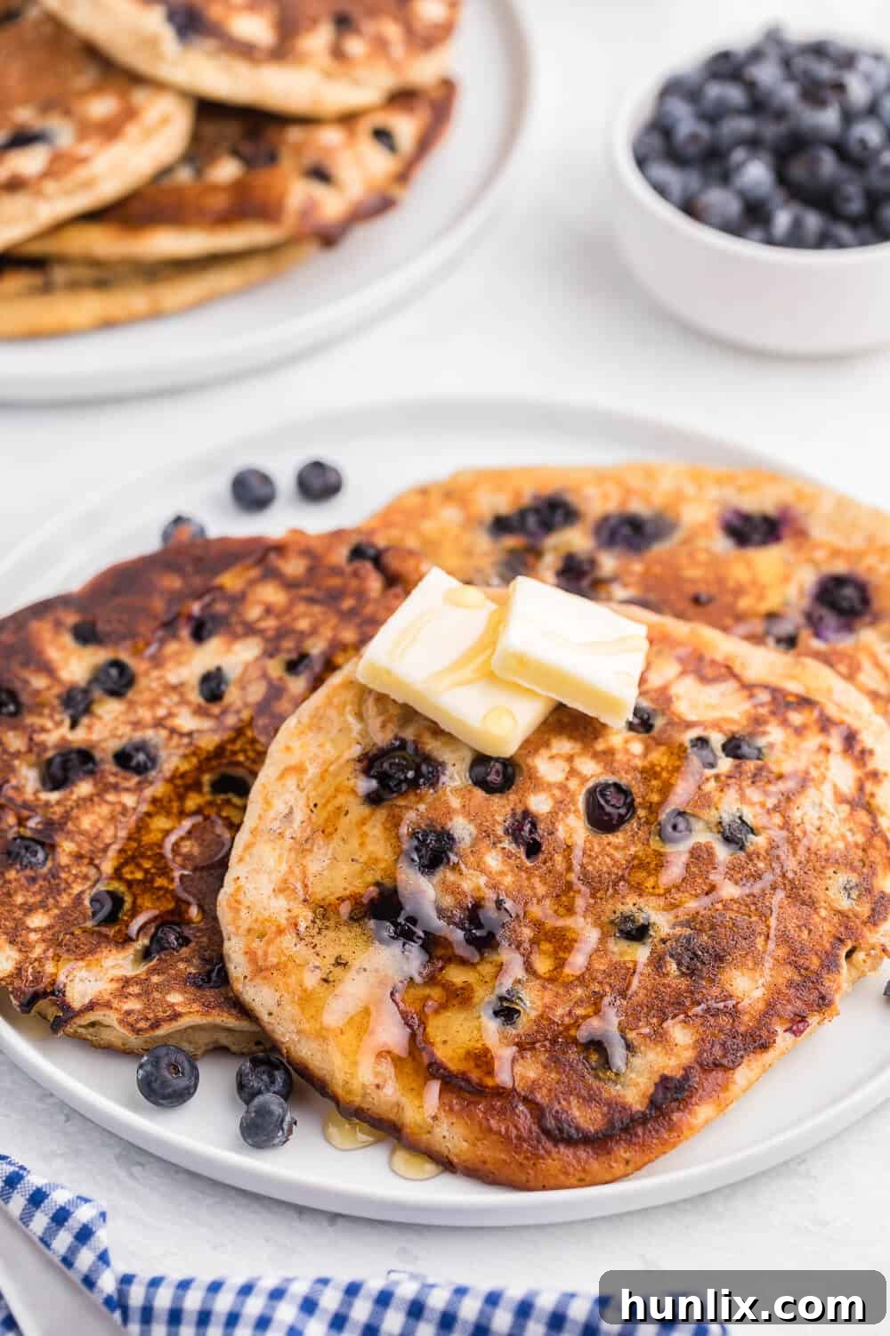Fluffy Whole Wheat Blueberry Morning Cakes 4 Ingredients for Whole Wheat Blueberry Pancakes laid out on a table