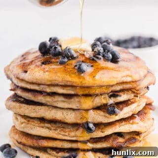 Whole Wheat Blueberry Pancakes - Blueberries are a wonder food, packed with fibre and antioxidants. Mixed into a light and fluffy whole wheat batter, these are a great way to add some extra nutrition without sacrificing delicious flavour.