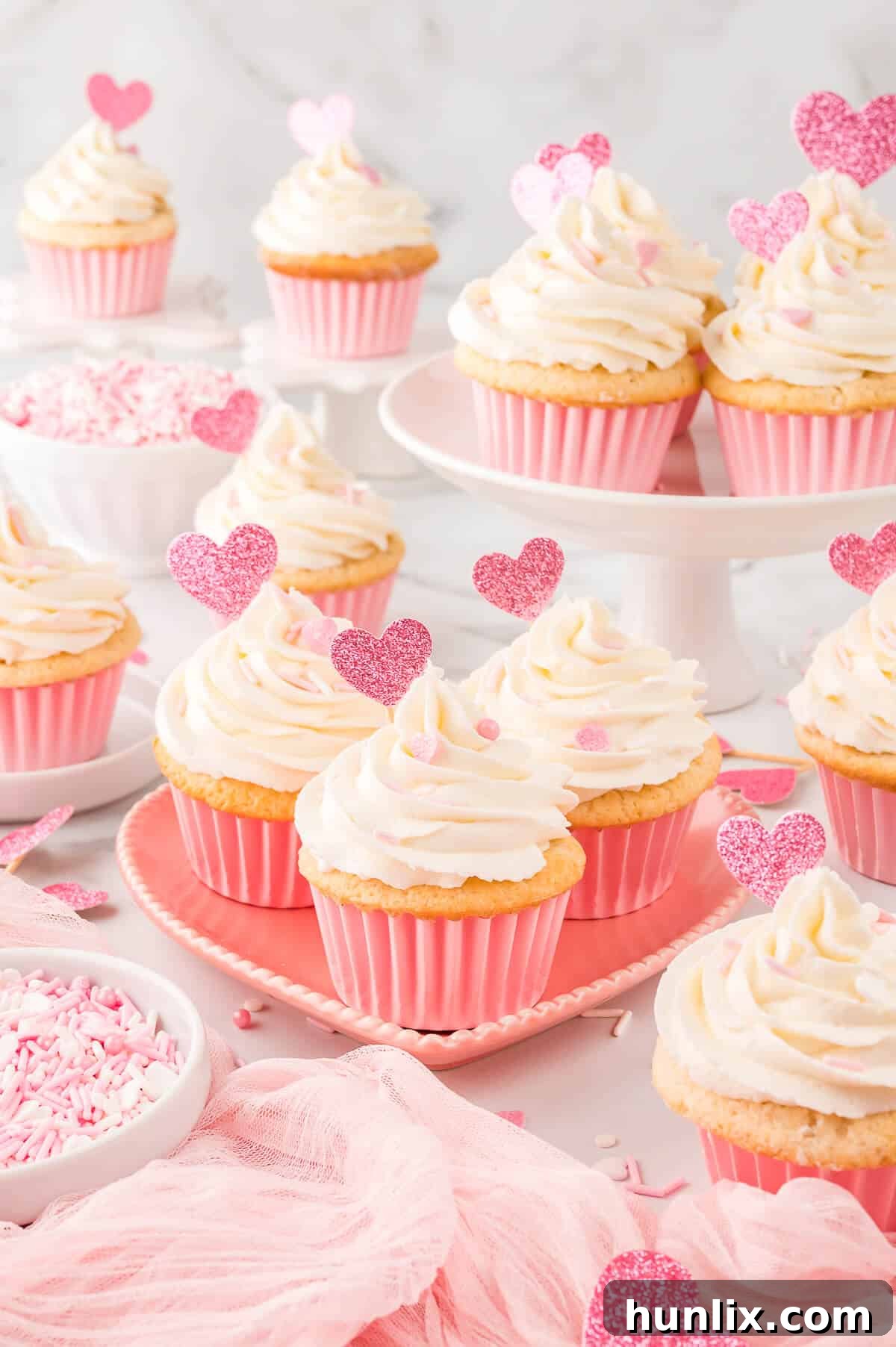 A single Valentine's Day cupcake, frosted and decorated, resting on a heart-shaped plate, emphasizing its romantic appeal.