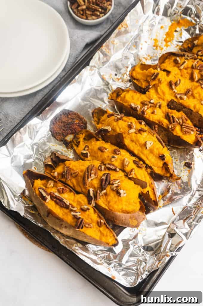 Creamy and rich Twice Baked Sweet Potatoes made with maple syrup and cream cheese, perfect for a sweet and savory side dish.