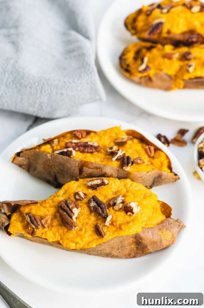 Finished Twice Baked Sweet Potatoes, garnished with pecans, ready to be served.