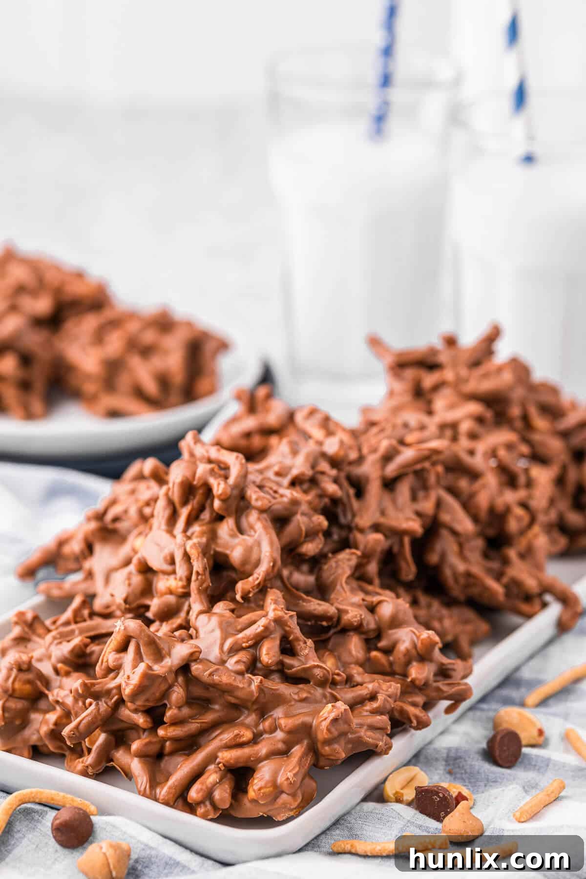 No-Bake Peanut Butter Chocolate Crunch Clusters 7 A bountiful platter of No-Bake Chocolate Peanut Butter Haystacks, arranged beautifully to showcase their golden crunch and chocolatey coating, ready for serving at a gathering.