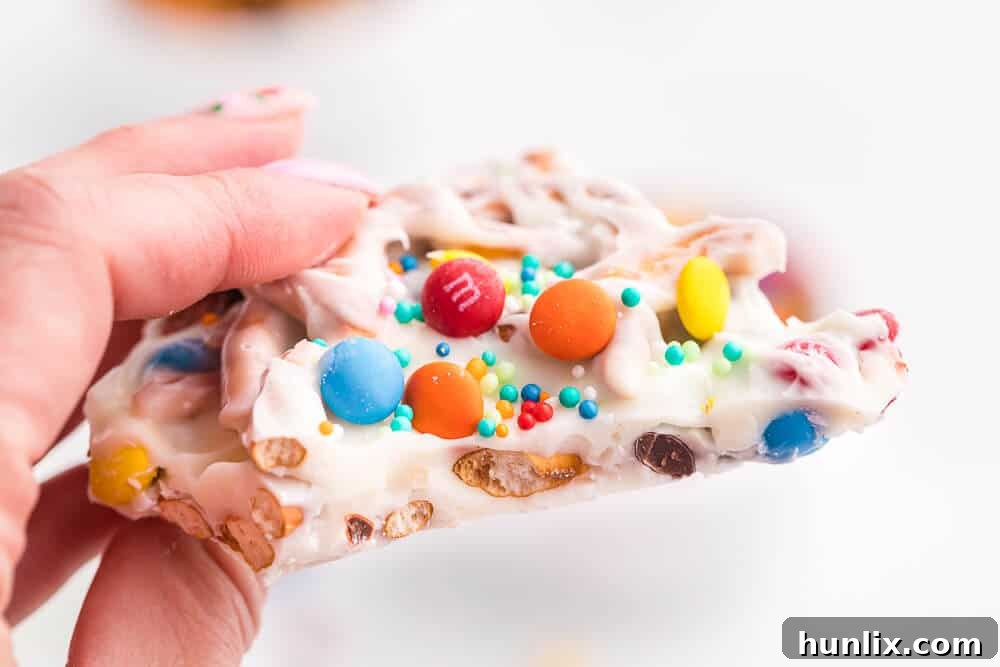 A hand holding a piece of the recipe.