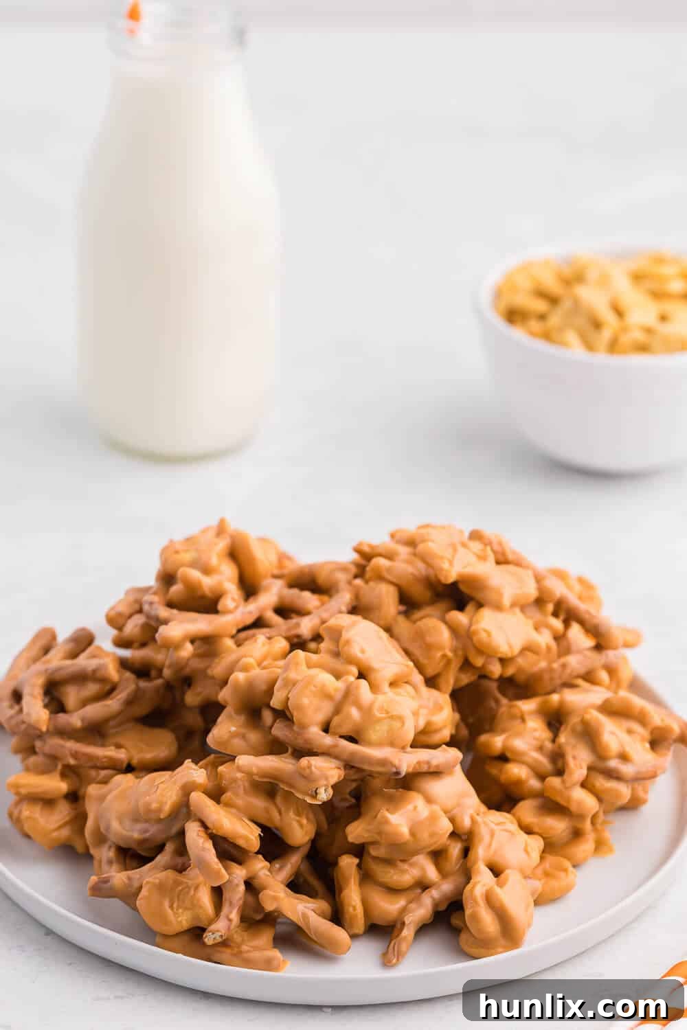 A close-up of several Goldfish Drops on a white plate, highlighting their appealing texture and golden hue.