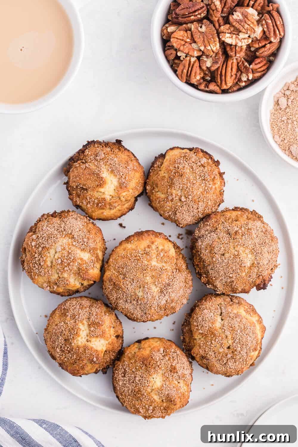 Delicious pecan coffee cake muffins arranged invitingly on a white plate