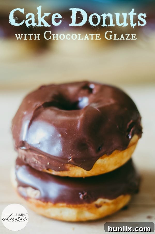 Close-up of fluffy Cake Donuts with decadent Chocolate Glaze. These baked treats are a healthier and simpler alternative to fried donuts.