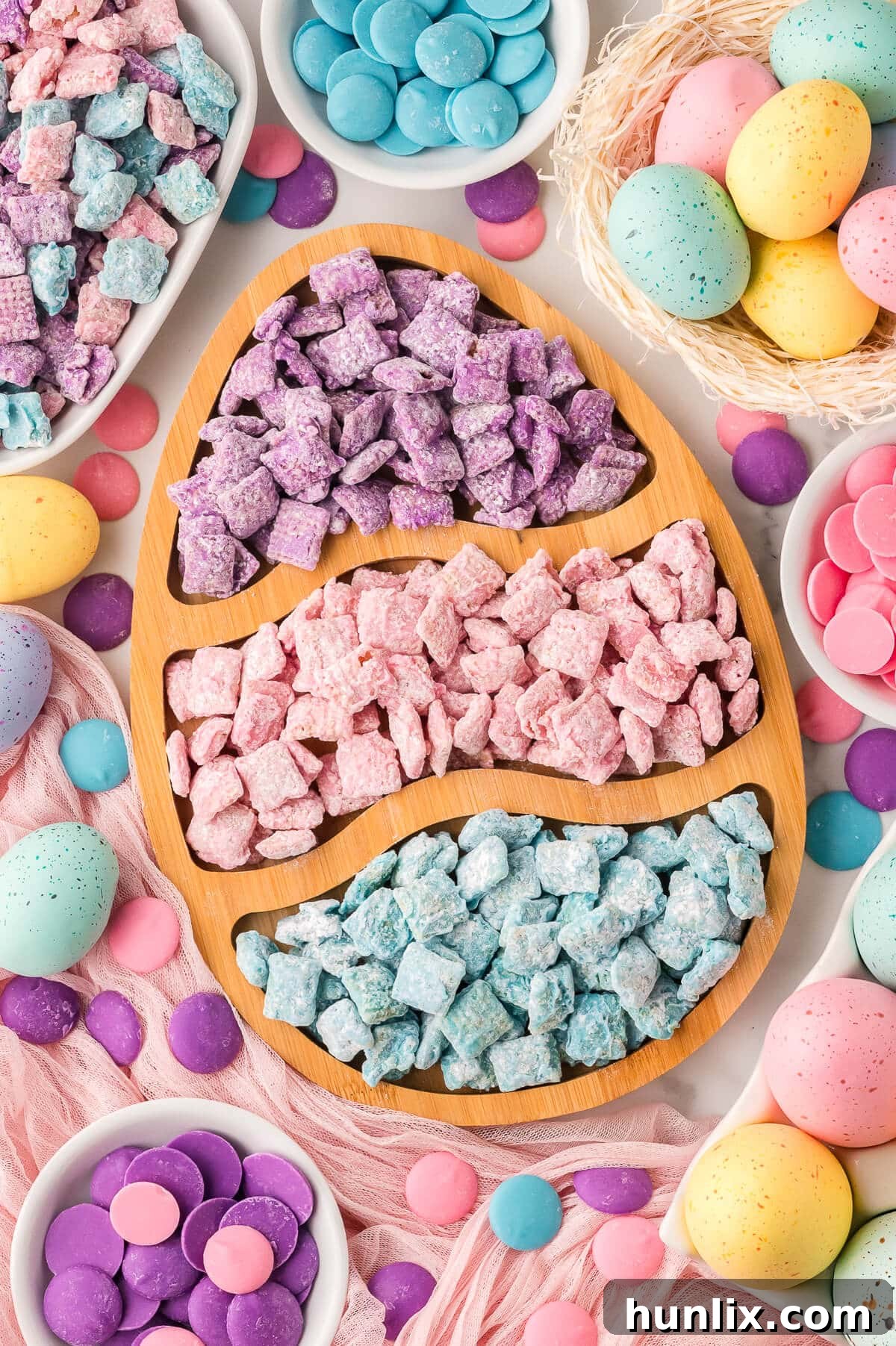 Easter Puppy Chow served in an Easter egg shaped dish.