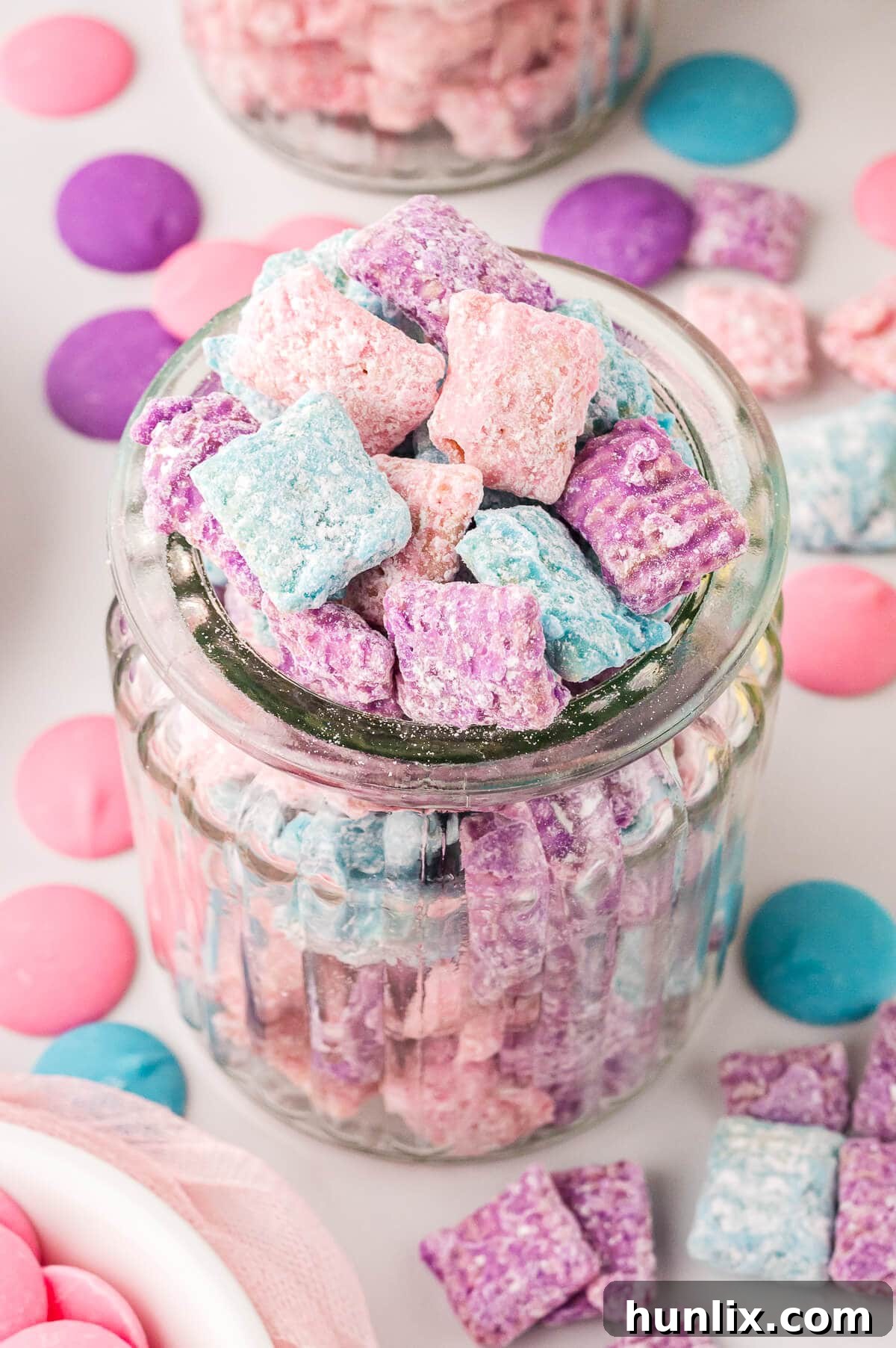 Easter Puppy Chow presented in a decorative glass jar.